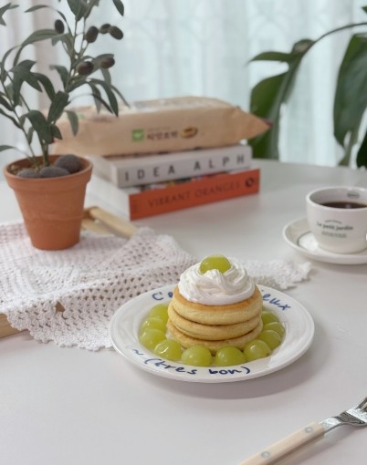 Sweet Seed Hotteok topped with whipped cream