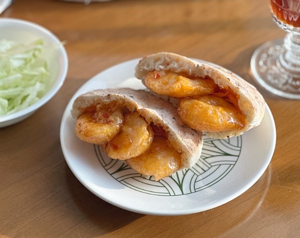 'pita bread sandwich' made of chili shrimp.